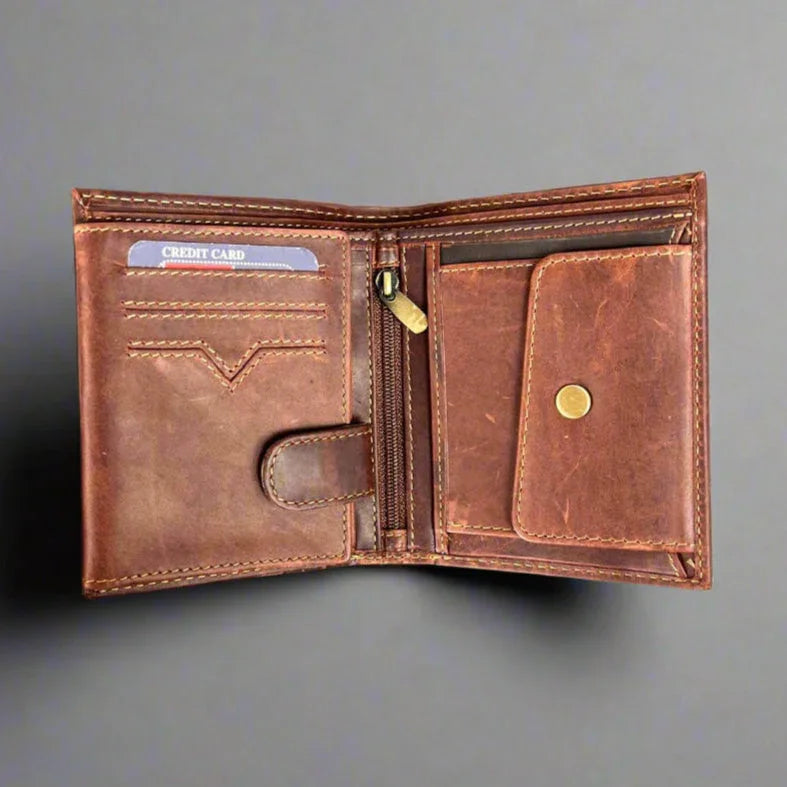 Open brown leather wallet with card slots, coin pocket, and zipper compartment