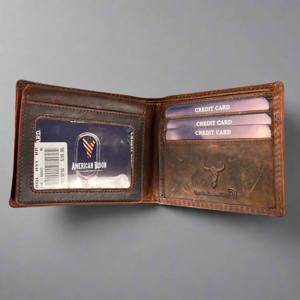 Open brown leather wallet with multiple credit cards and ID card on gray background