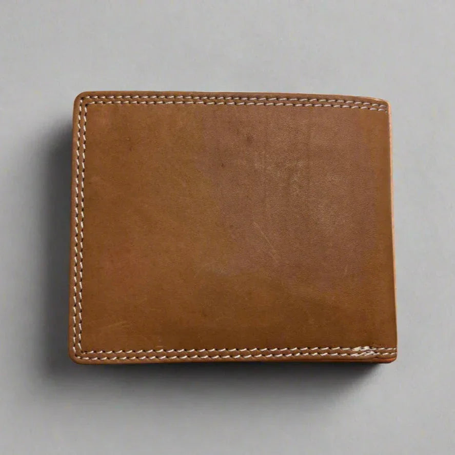 Brown leather bifold wallet with white stitching on a plain light background
