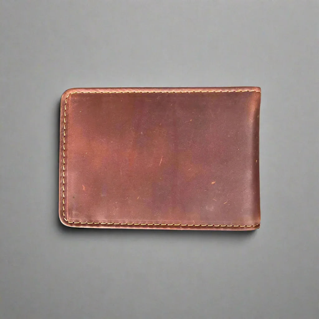 Brown leather wallet with visible stitching on gray background