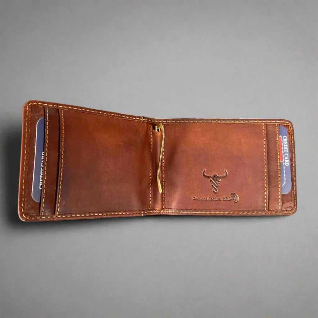 Open brown leather wallet with bull logo, card slots, and money clip on gray background