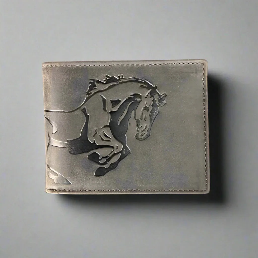 Gray leather wallet with embossed running horse design on a plain background
