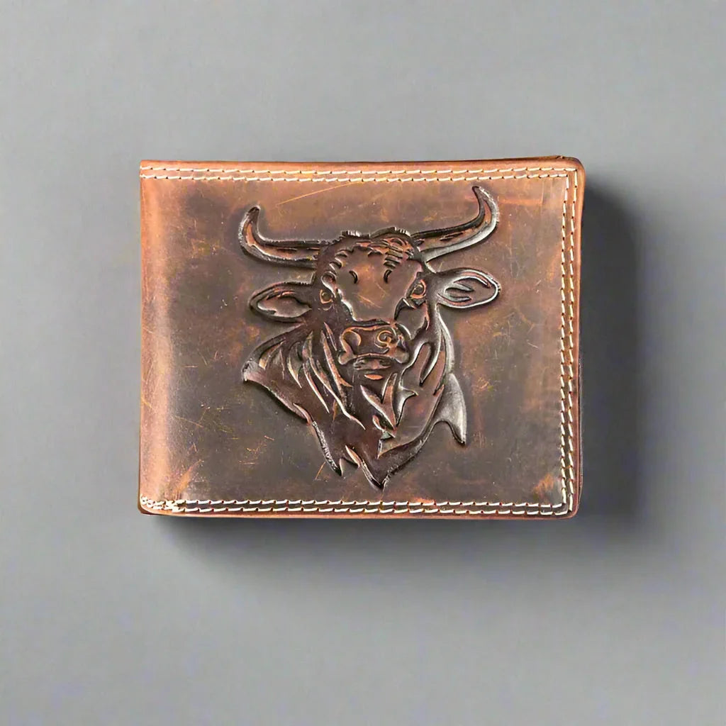 Brown leather wallet with embossed bull head design and visible stitching on gray background