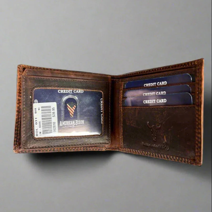 Brown leather wallet with multiple credit cards and American Bison card on gray background