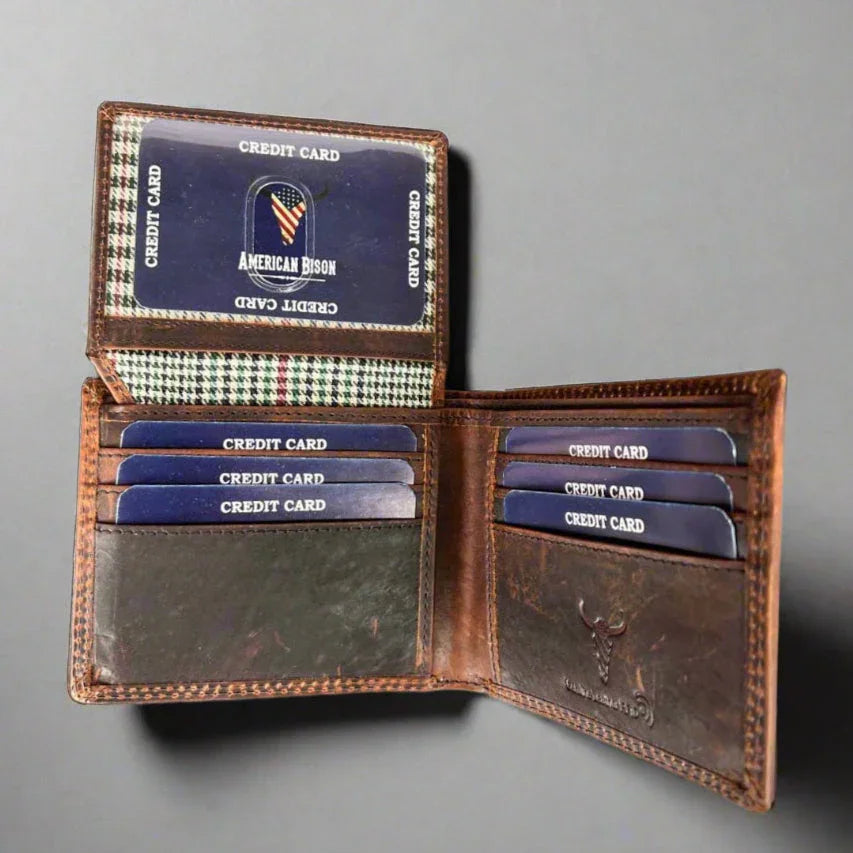 Open brown leather wallet with visible credit cards on a gray background