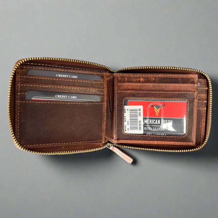 Brown leather zippered wallet with card slots and RFID security card on gray background