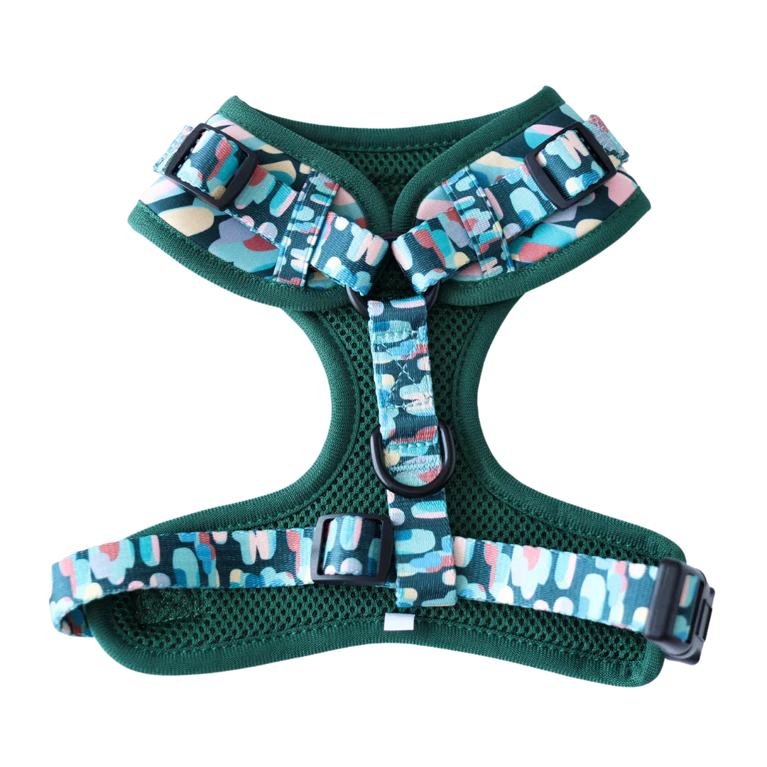 Green mesh dog harness with colorful camo straps and adjustable black buckles
