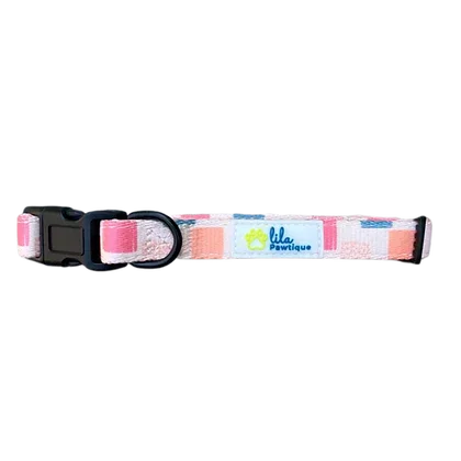Pink and peach geometric dog collar with black buckle and Lila Pawtique logo tag