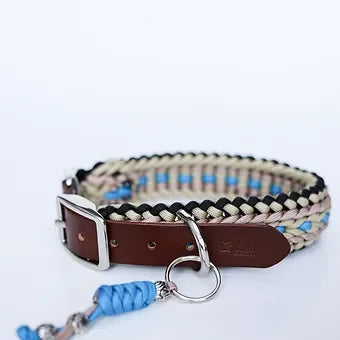 Braided dog collar with blue and beige rope, brown leather buckle, and metal ring on white background
