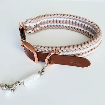 Handmade braided dog collar with leather buckle in beige, white, and rose gold accents.