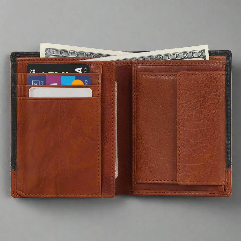 Brown leather wallet open with credit cards and cash inside on a gray background