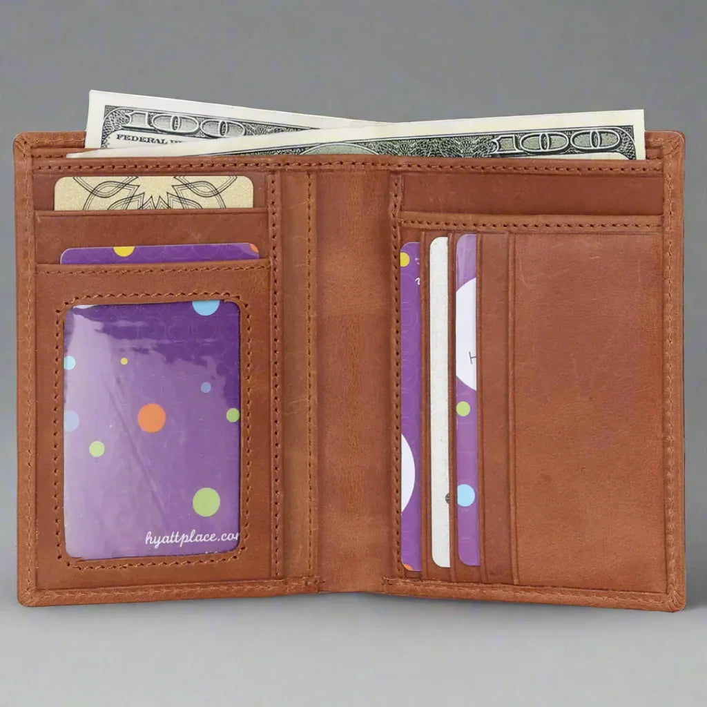 Open beige leather wallet with cash, credit cards, and ID slots on grey background