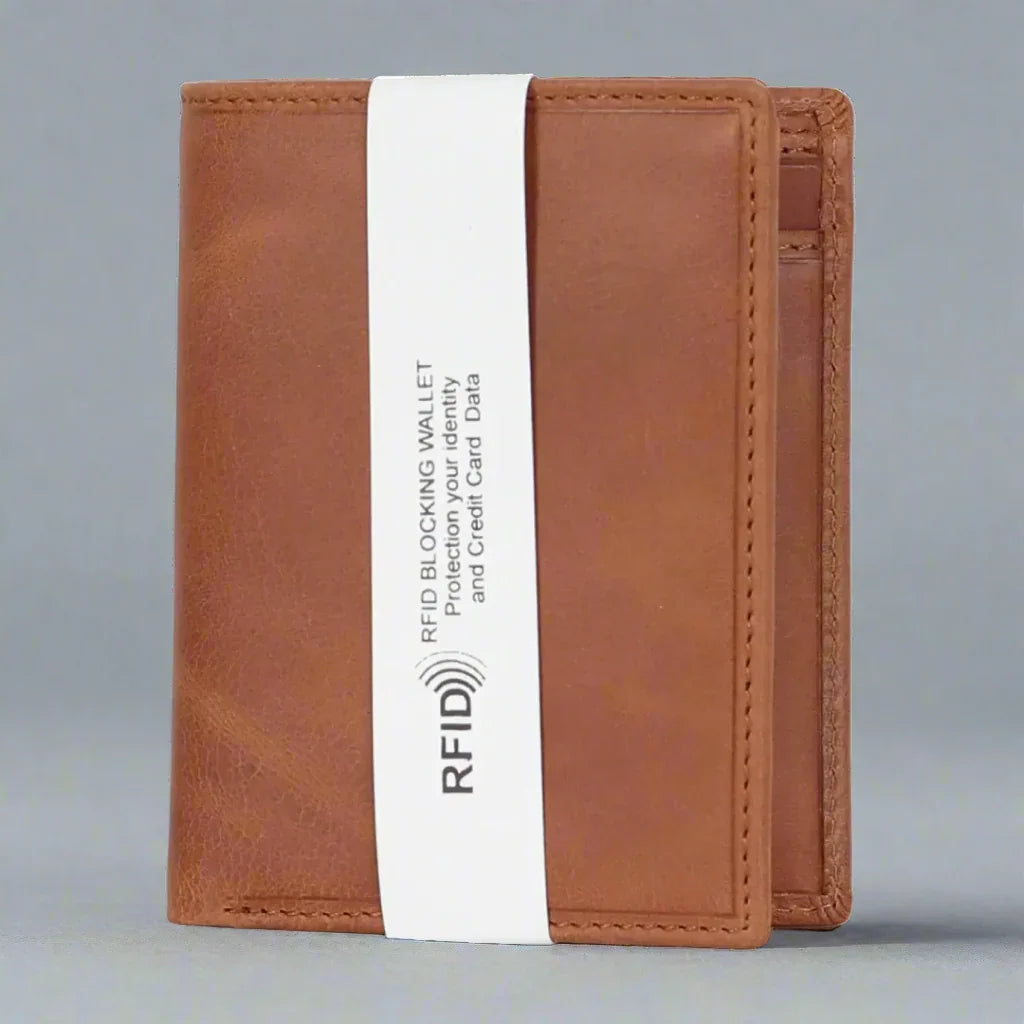 Beige RFID blocking leather wallet standing upright on a plain gray background