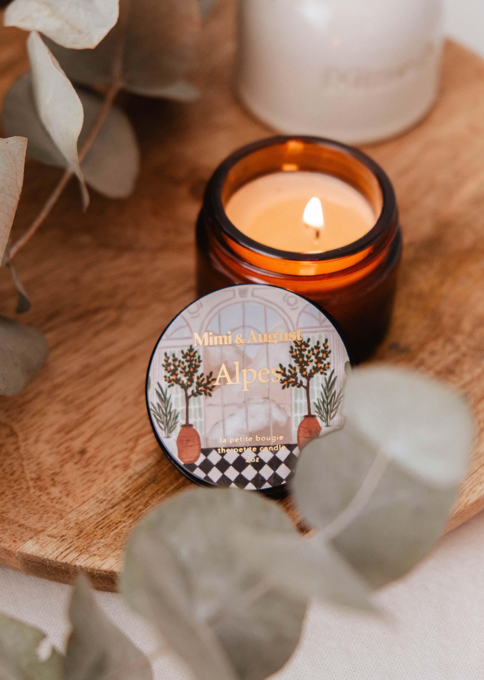 Mimi & August Alpes mini candle in amber jar on wooden tray with botanical lid design