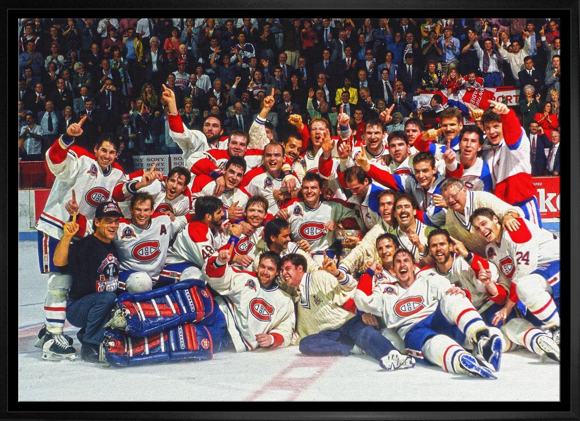 Montreal Canadiens hockey team celebrating on ice in front of cheering crowd
