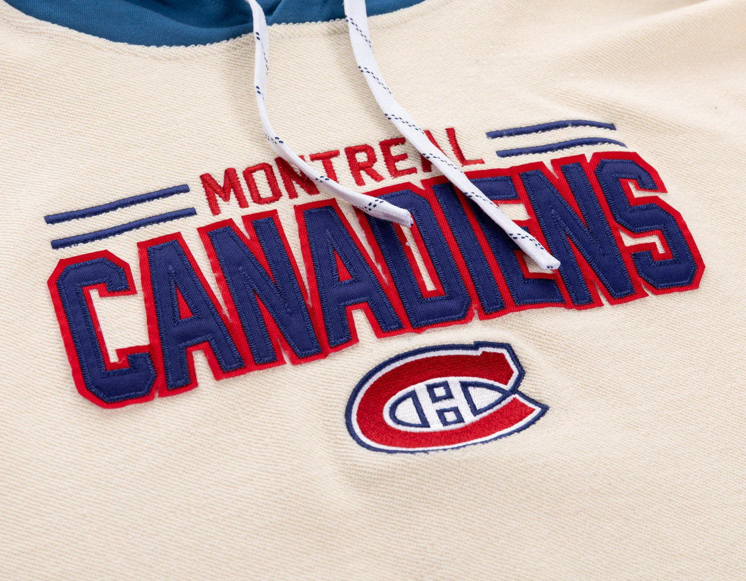 Montreal Canadiens cream hoodie detail with embroidered logo and blue hood