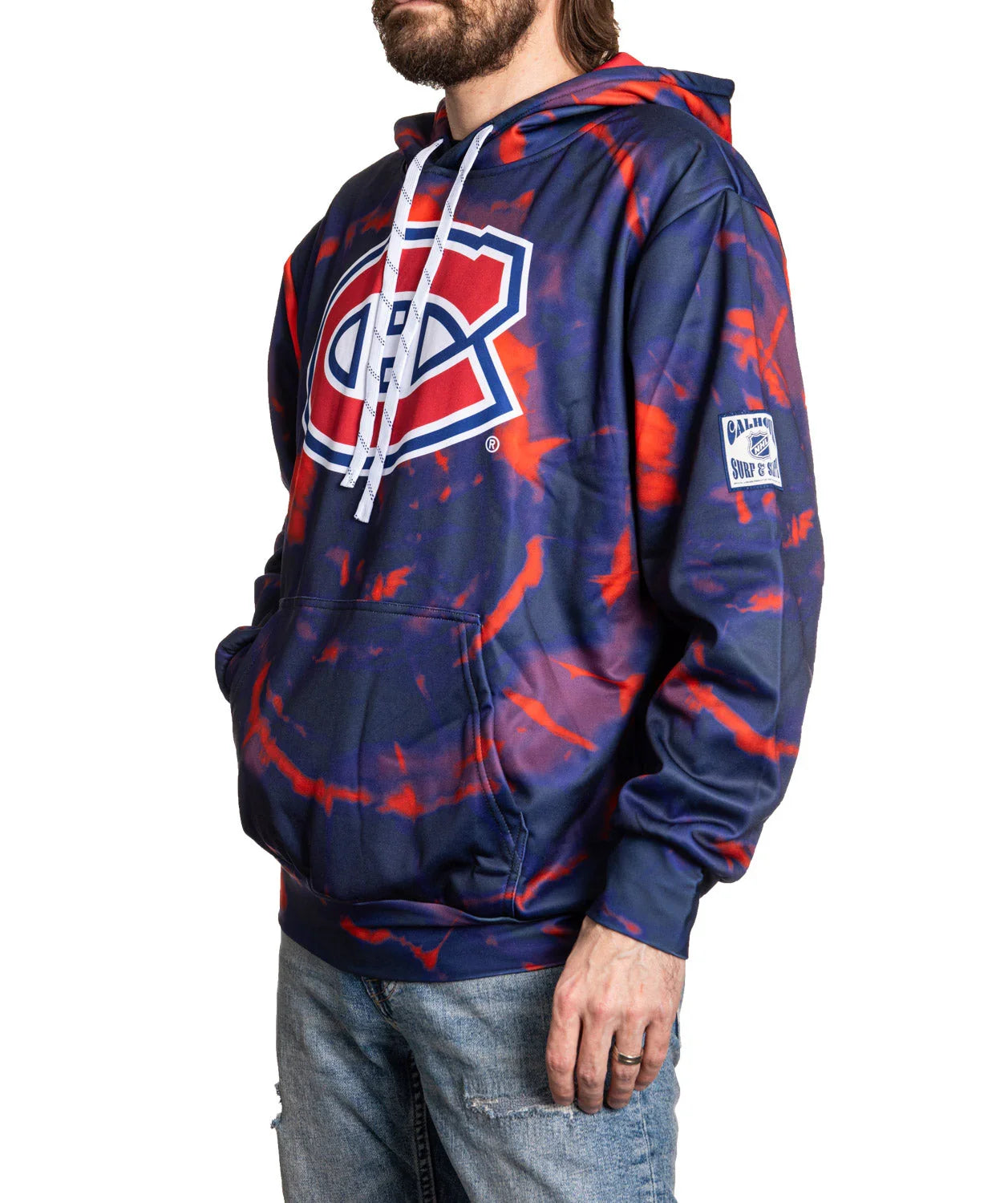 Man wearing Montreal Canadiens navy and red tie-dye hooded sweatshirt with large logo