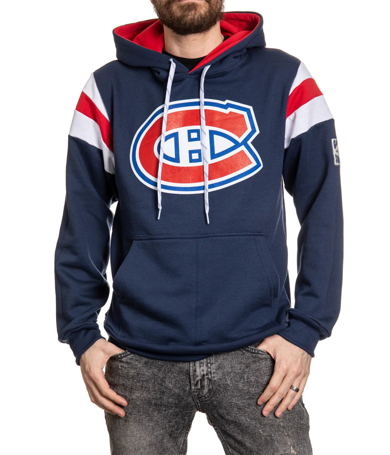 Man wearing navy Montreal Canadiens hoodie with red and white stripes on sleeves