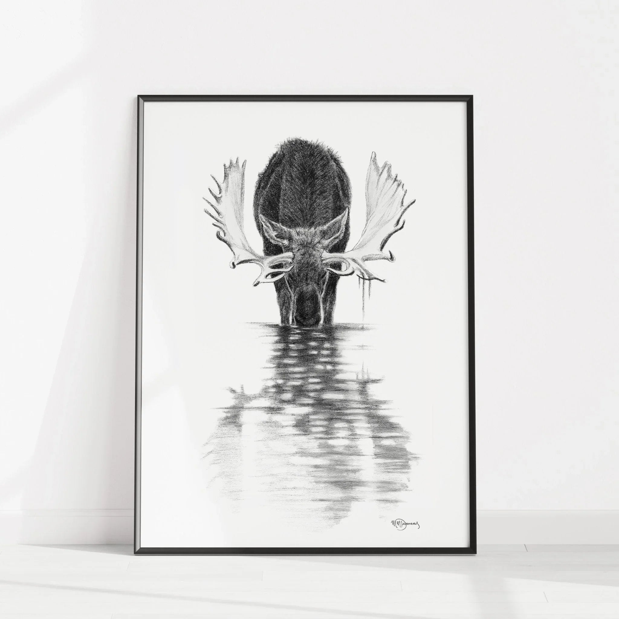 Framed black and white moose drawing reflecting in calm water, minimalist wall art