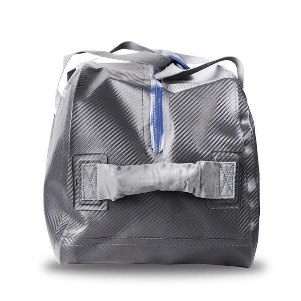 Gray waterproof duffel bag with blue zipper and reinforced handles on white background