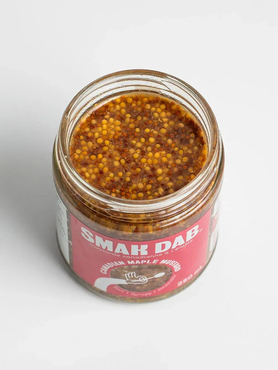 Open jar of Smak Dab Canadian Maple Mustard with visible mustard seeds