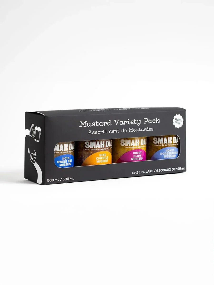 SMAK DAB mustard variety pack with four assorted mustard jars in black packaging.
