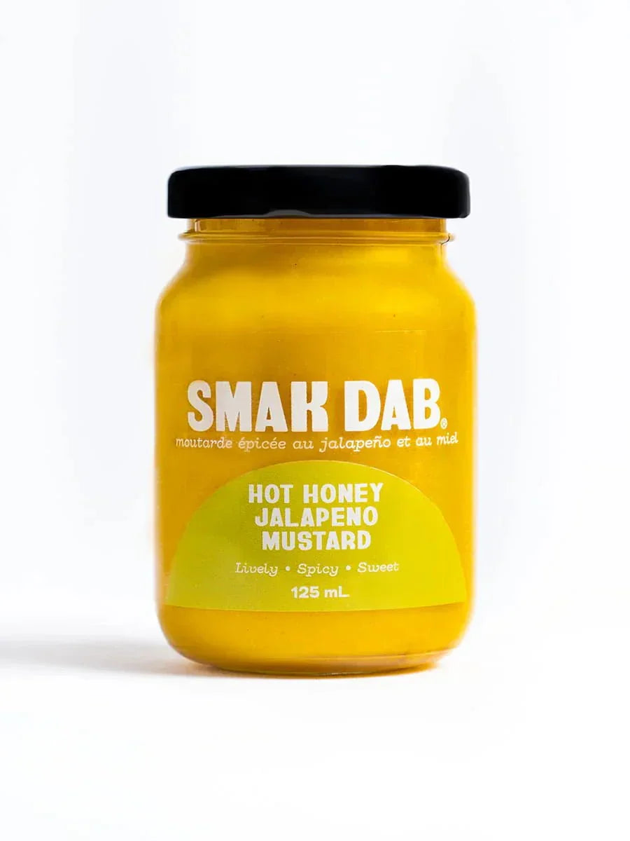 Jar of Smak Dab Hot Honey Jalapeno Mustard with black lid on white background