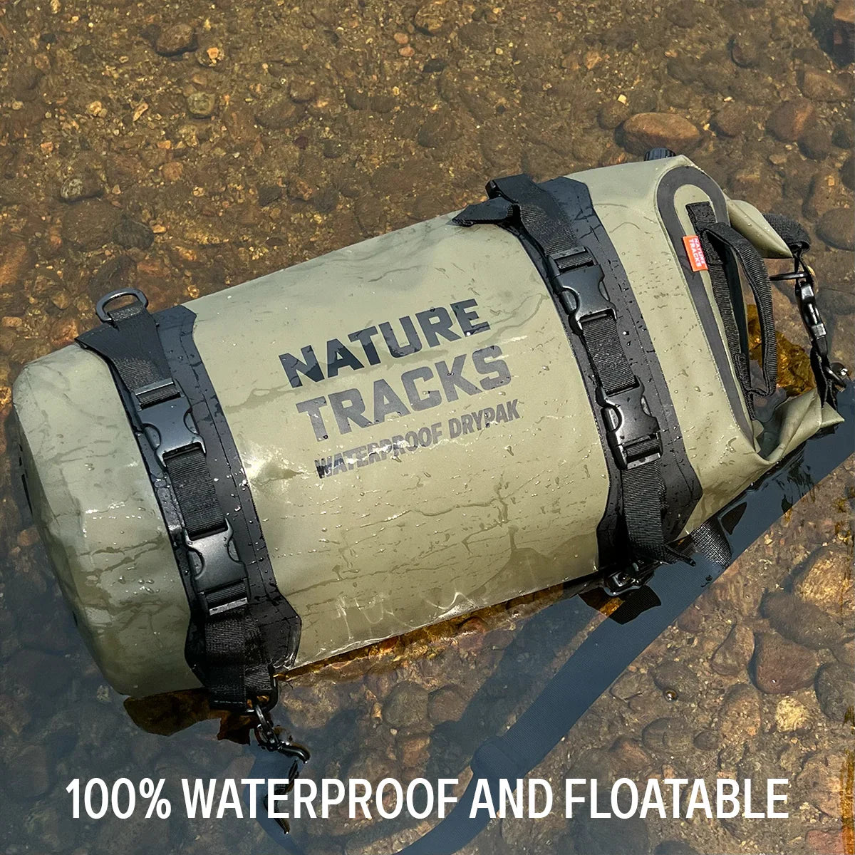 Nature Tracks waterproof dry bag floating in shallow water, durable outdoor gear