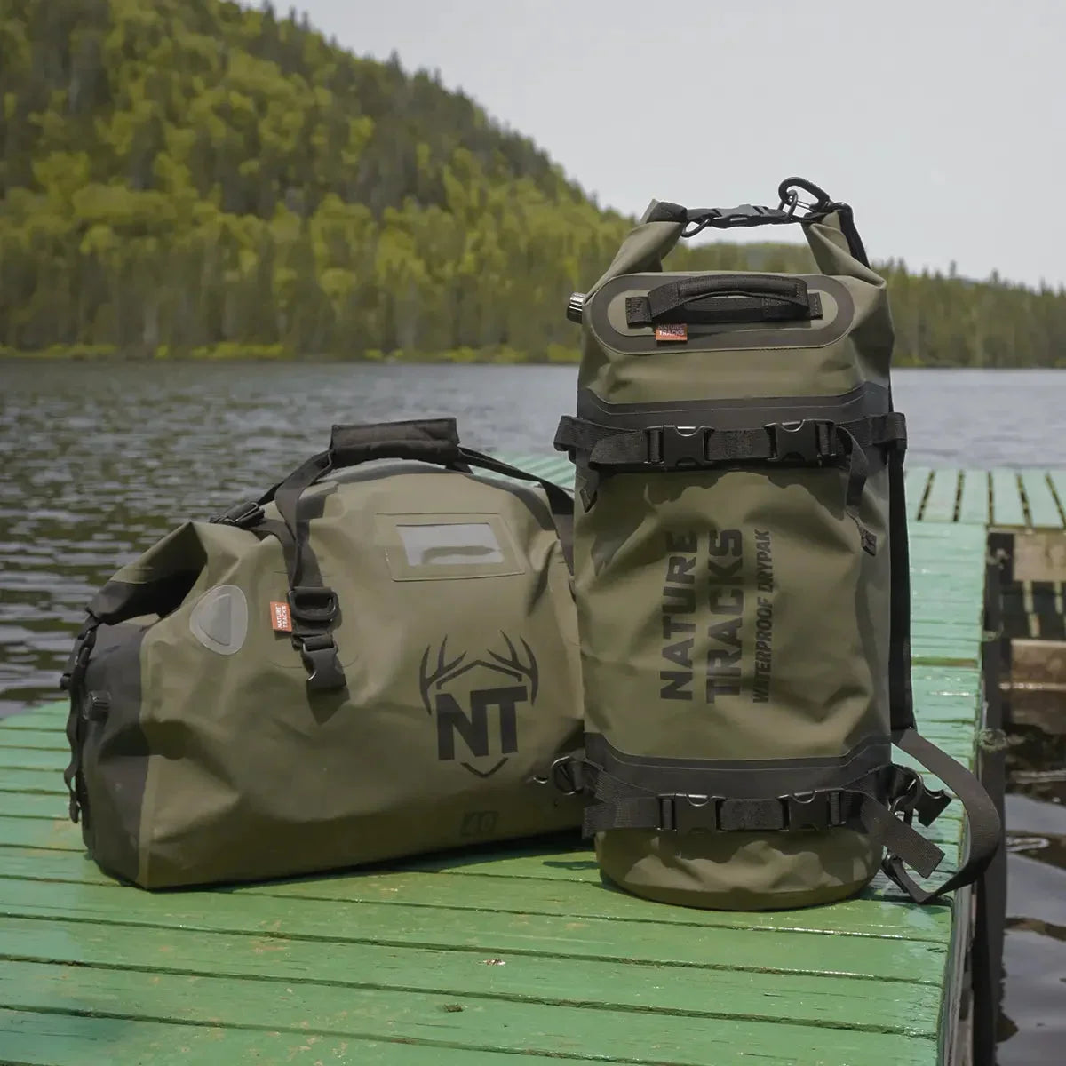 Nature Tracks waterproof duffel and dry bag on dock by lake with forested background