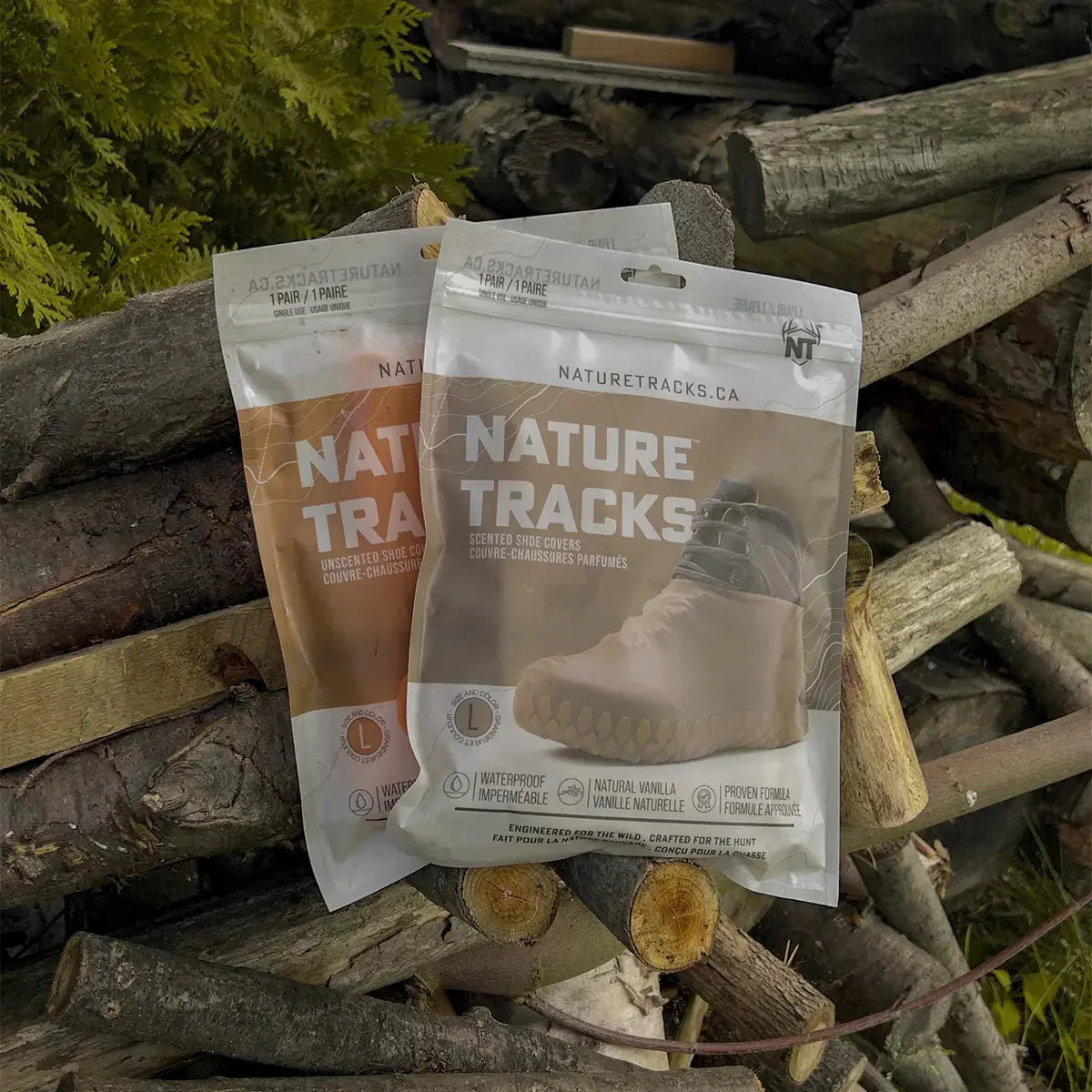 Nature Tracks shoe cover packaging on stacked logs outdoors