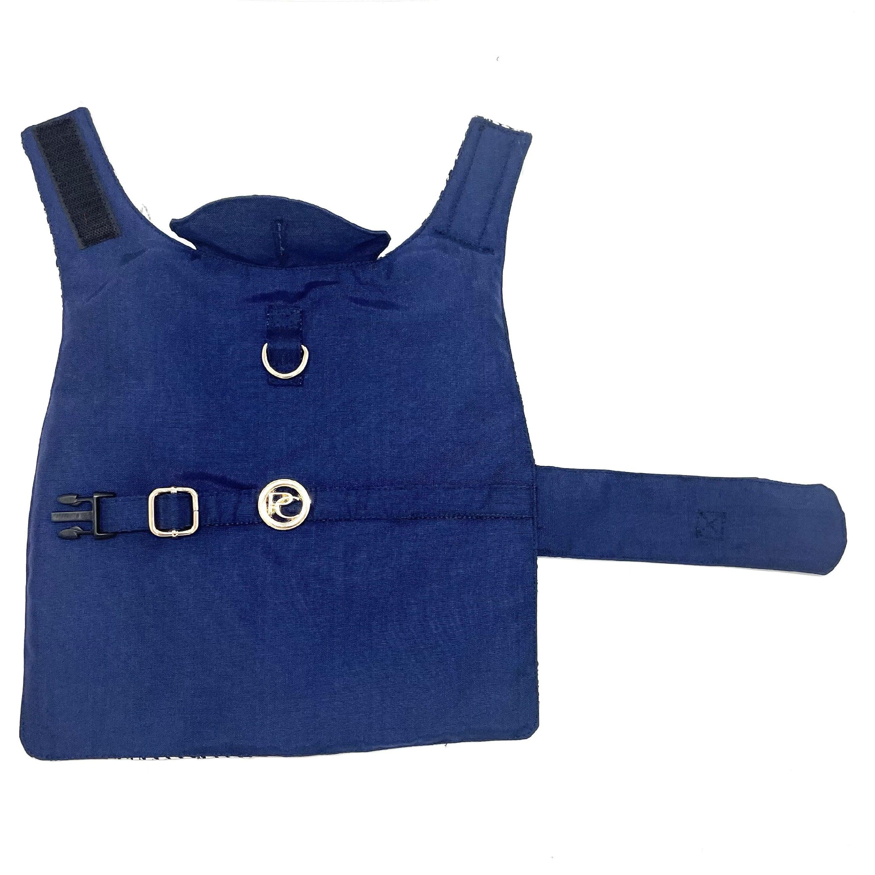 Navy blue dog harness with metal D-ring and side buckle on white background