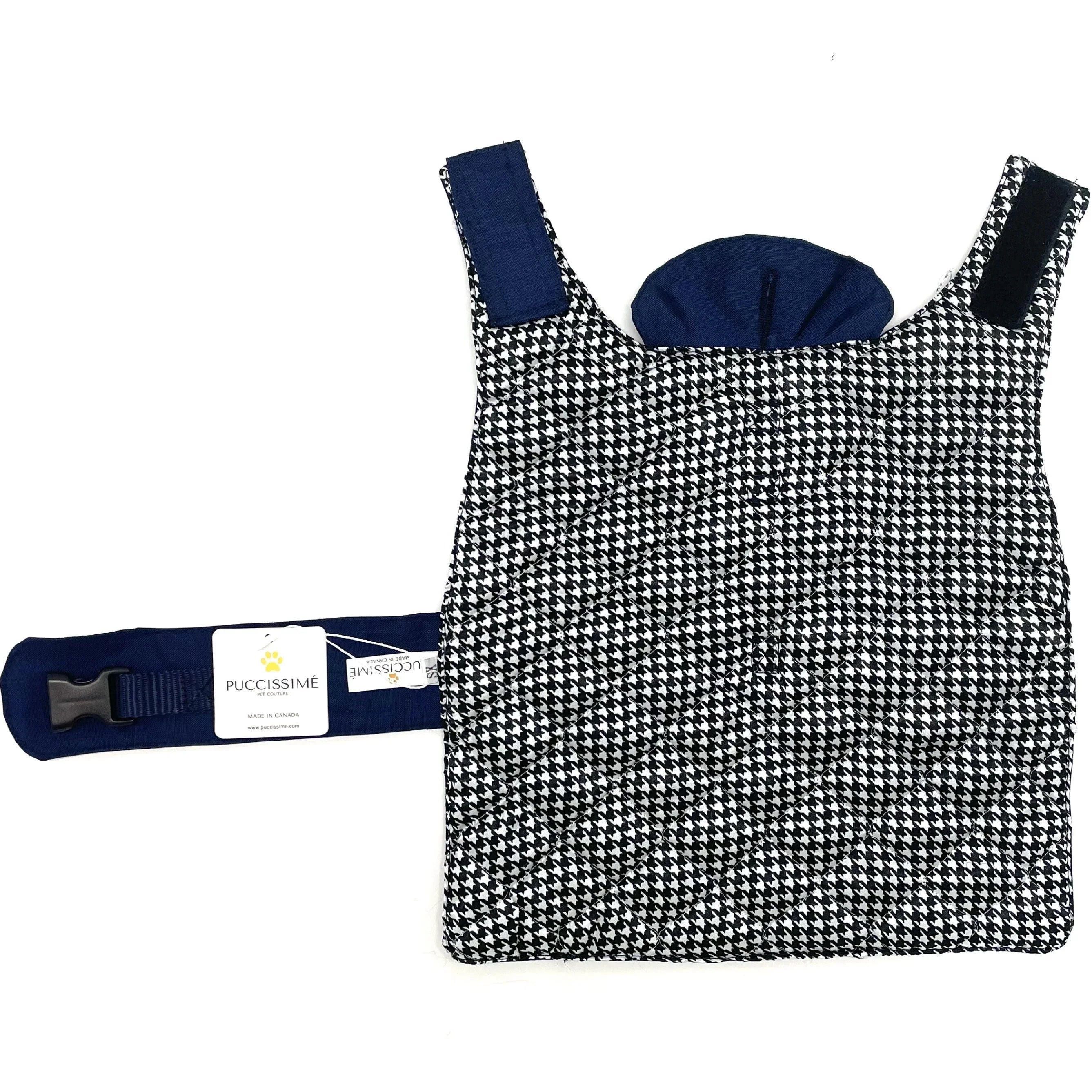 Black and white houndstooth pet carrier with navy straps by Puccissime, flat lay view