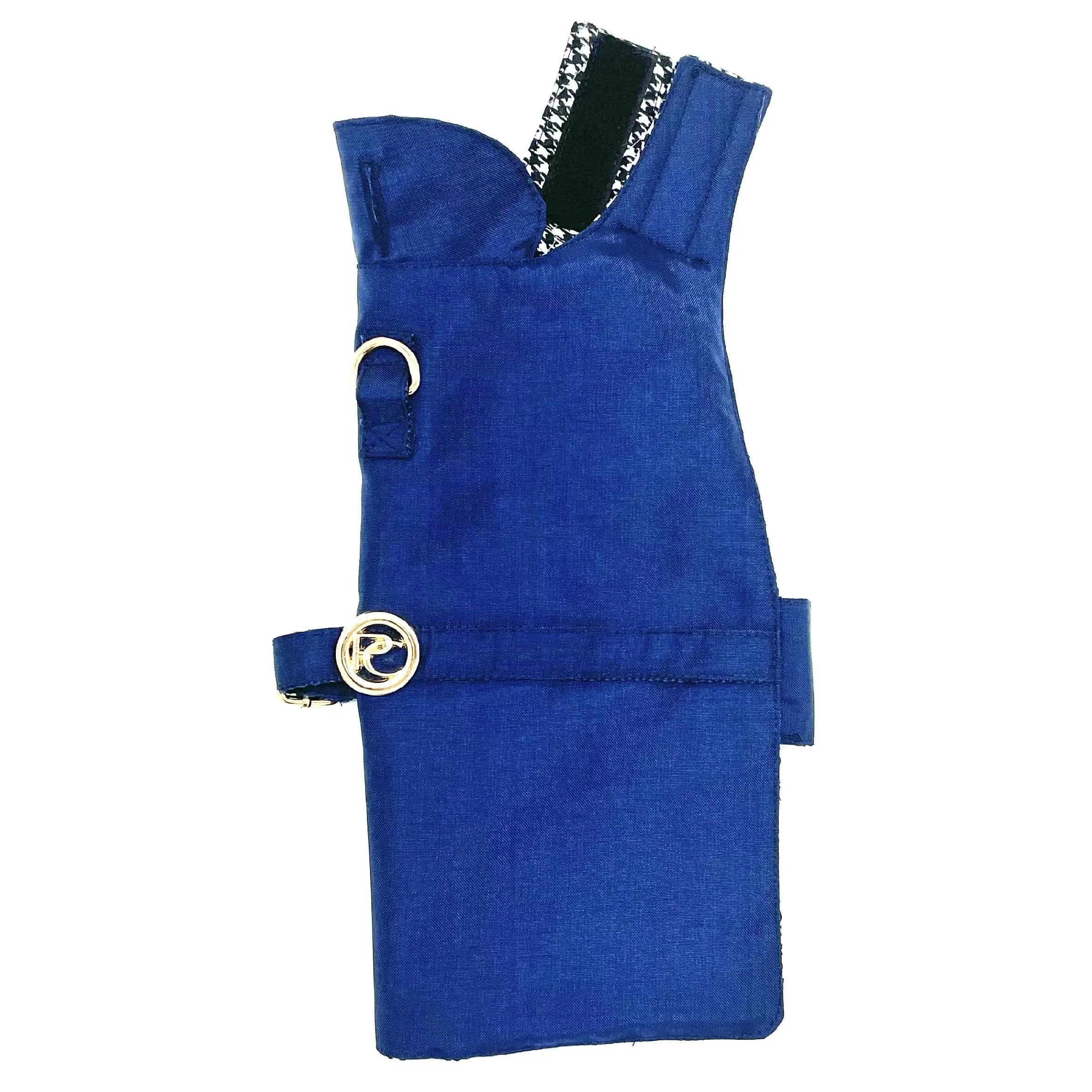 Blue dog harness vest with silver buckle and black-and-white trim on white background