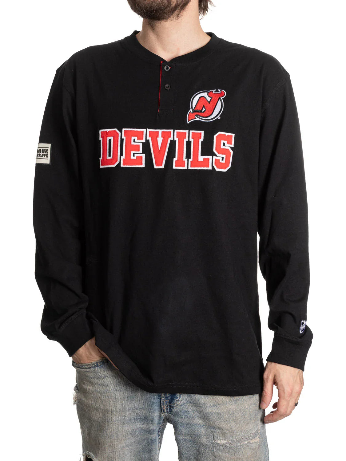 Man wearing black New Jersey Devils long sleeve henley shirt with red and white logo