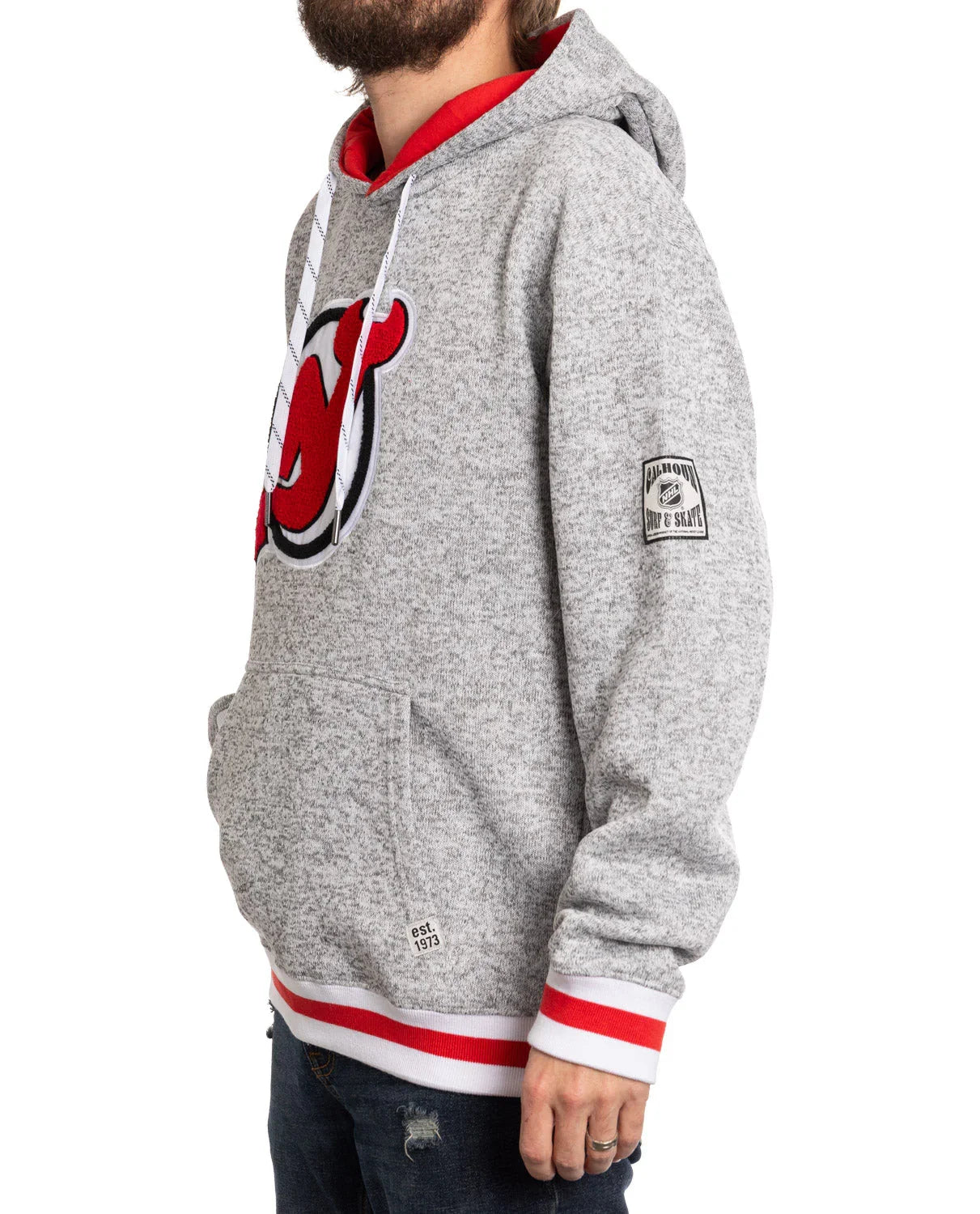 Man wearing grey New Jersey Devils logo hoodie with red and white trim