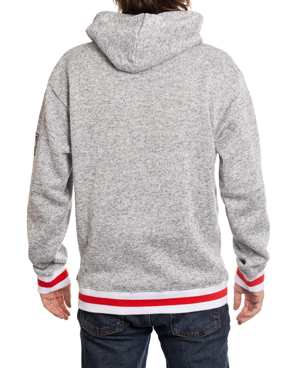 Back view of gray hooded sweatshirt with red and white striped cuffs and hem