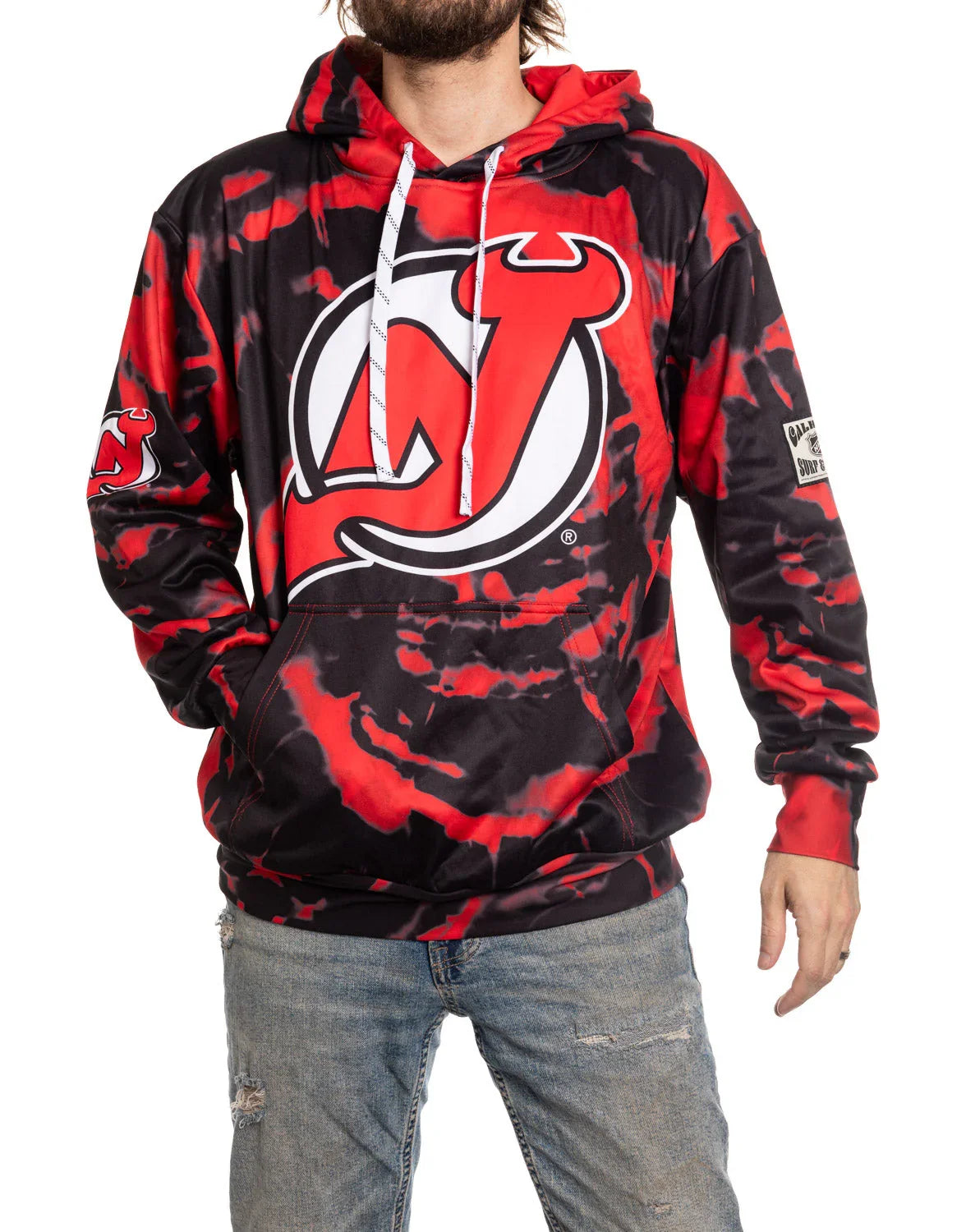Man wearing red and black tie-dye Devils hoodie with large team logo and drawstring hood
