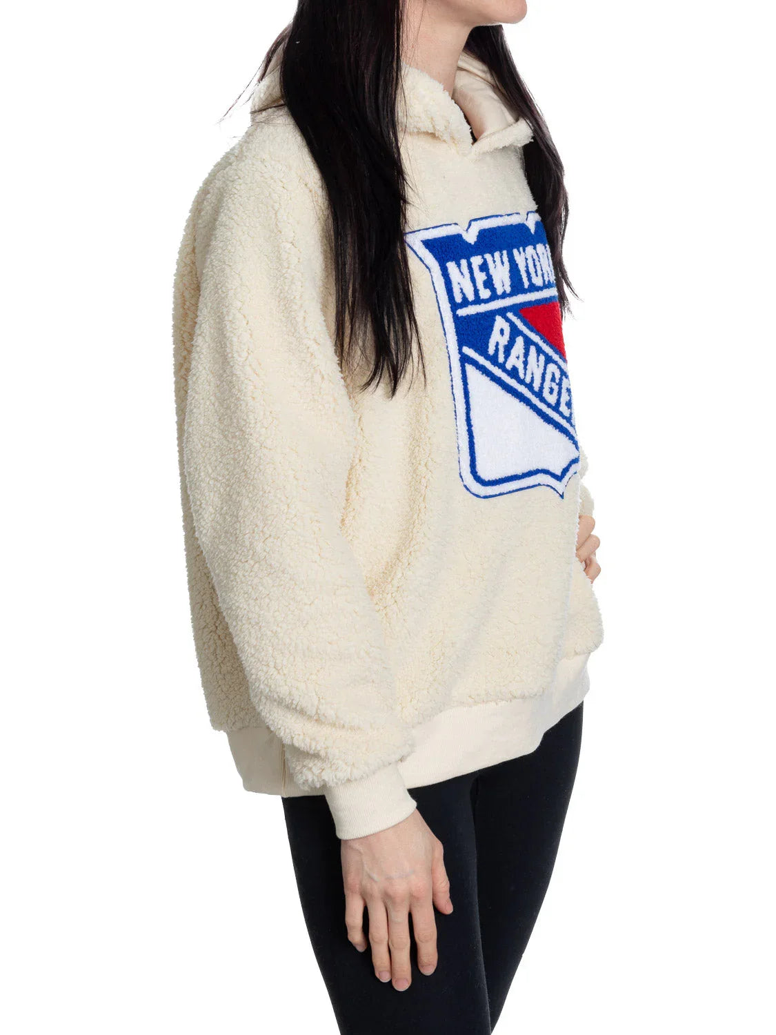 Woman wearing cream New York Rangers sherpa hoodie, side view, on white background