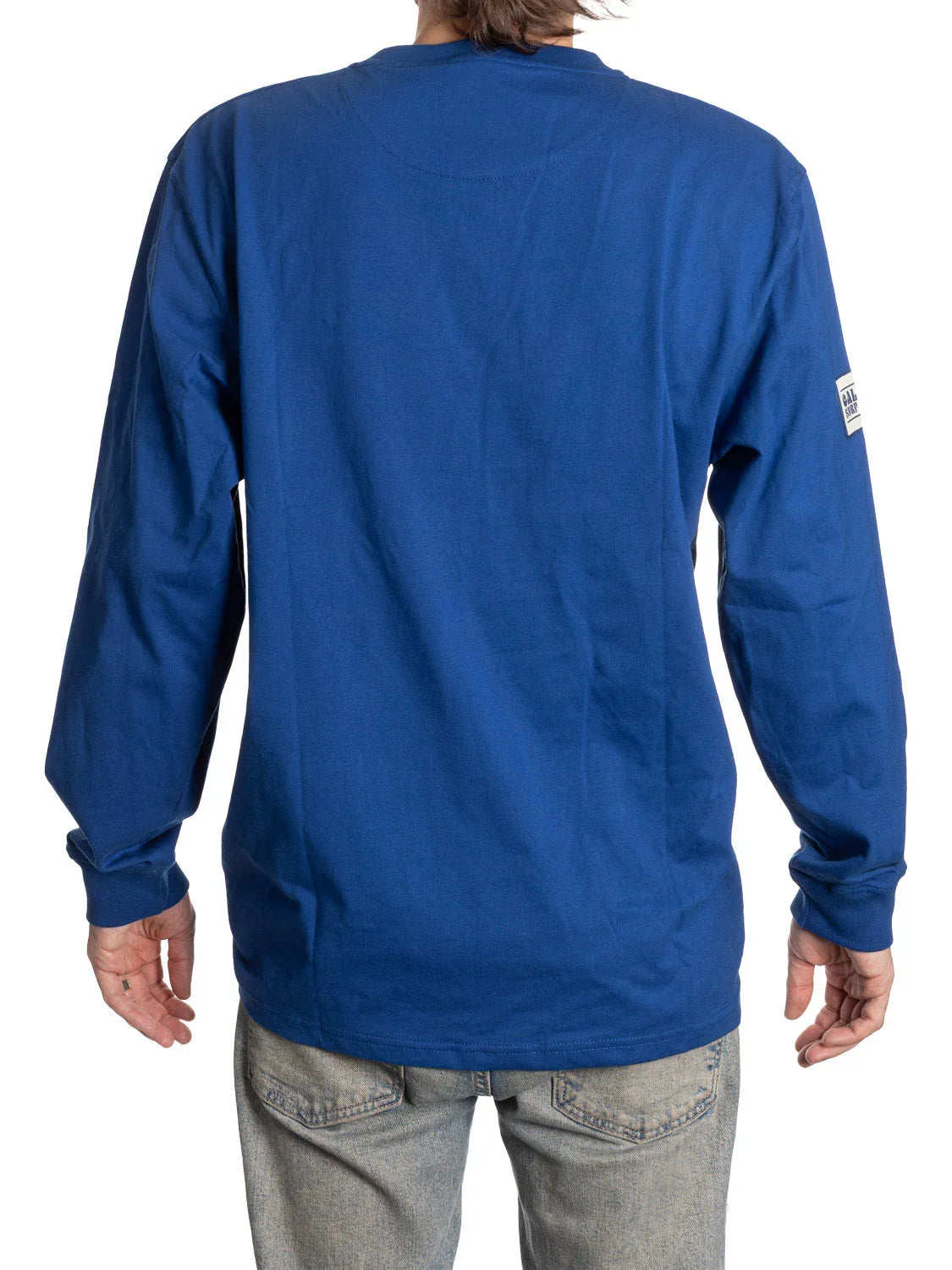 Back view of blue long sleeve Henley shirt on model with light denim jeans