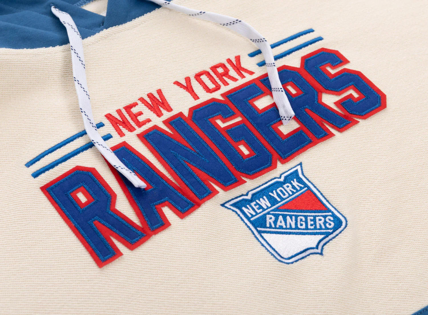 New York Rangers hoodie cream blue embroidered logo and drawstrings close-up
