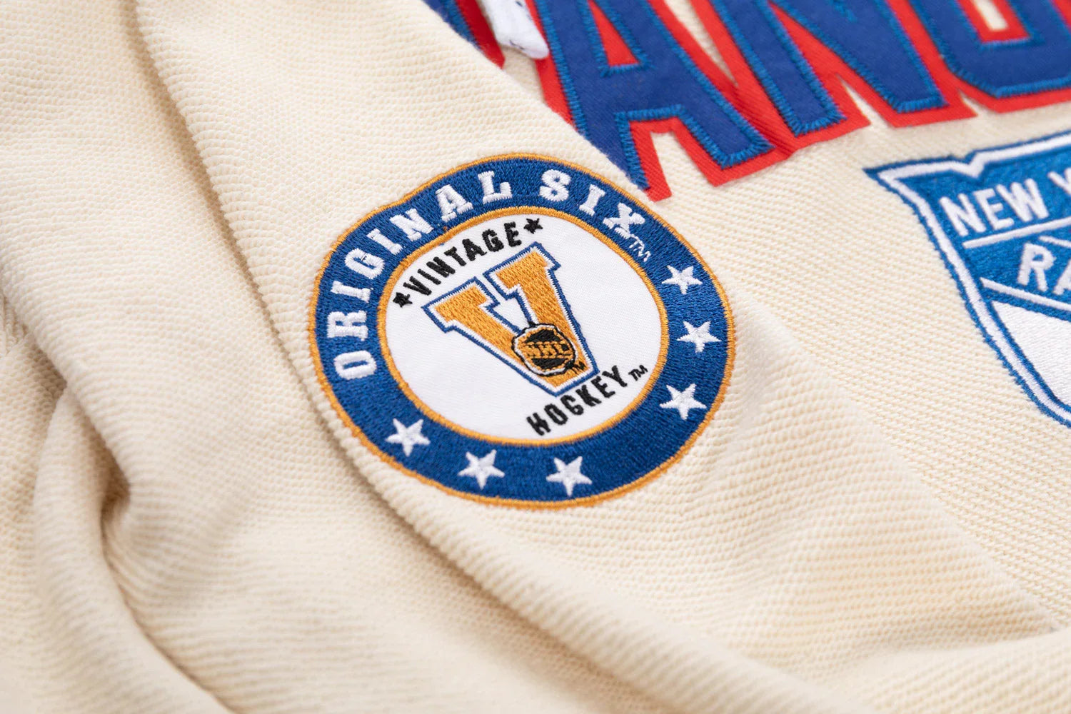 Vintage Hockey Original Six embroidered patch on cream New York Rangers hoodie