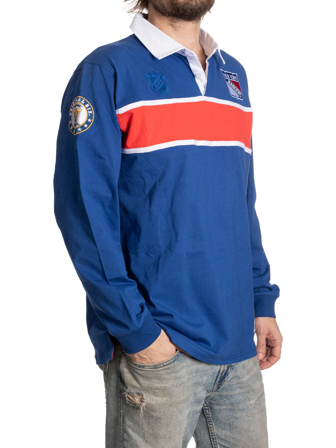 Man wearing blue New York Rangers rugby shirt with red stripe and NHL patch