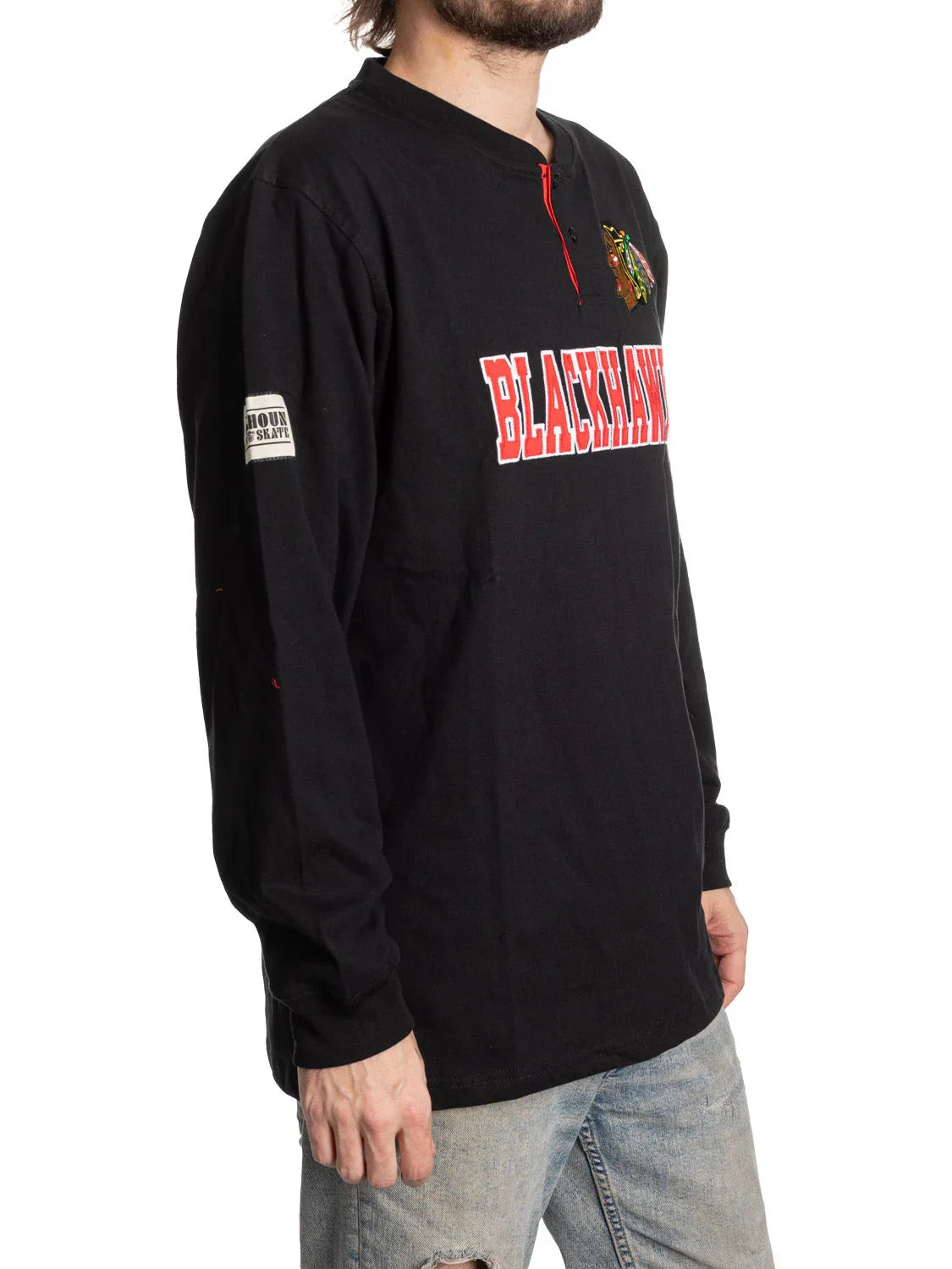 Man wearing black Chicago Blackhawks long sleeve henley shirt with embroidered logo