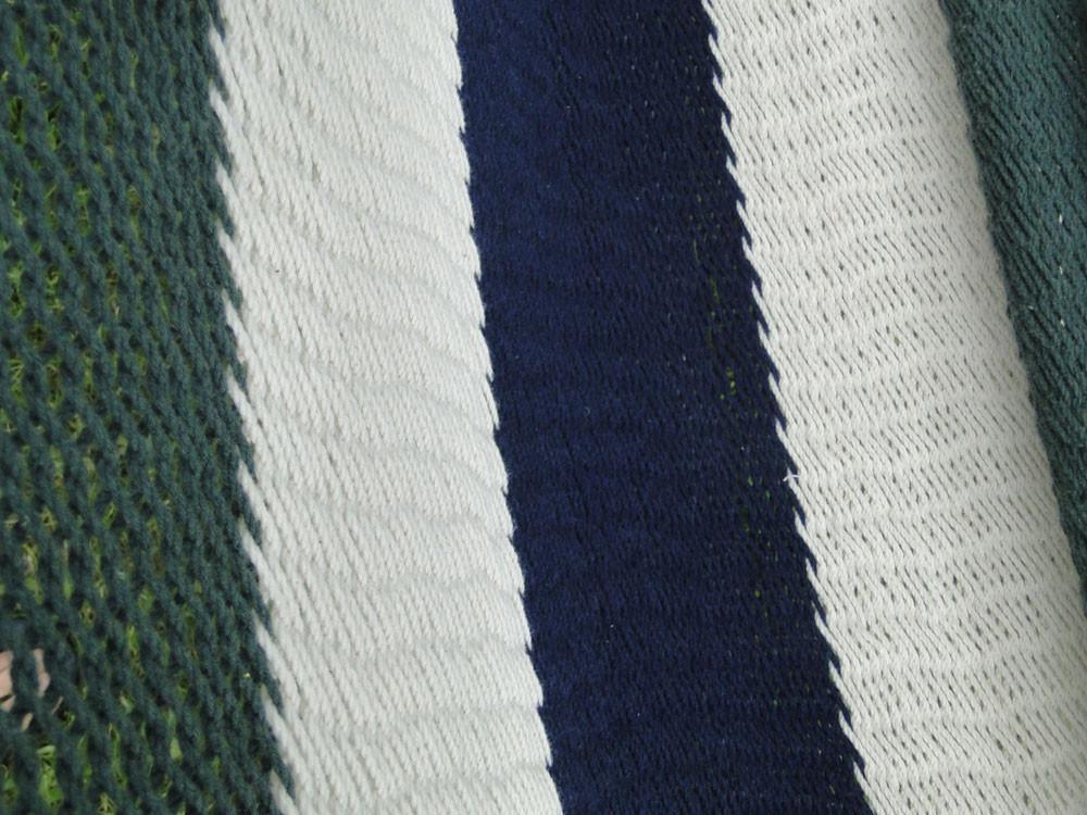 Close-up of Nicaraguan hammock with blue, white, and green woven cotton stripes