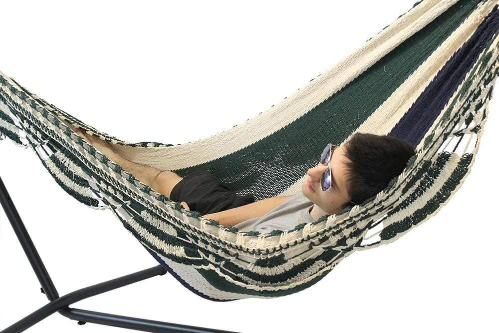 Man relaxing in a Nicaraguan hammock with stand, wearing sunglasses