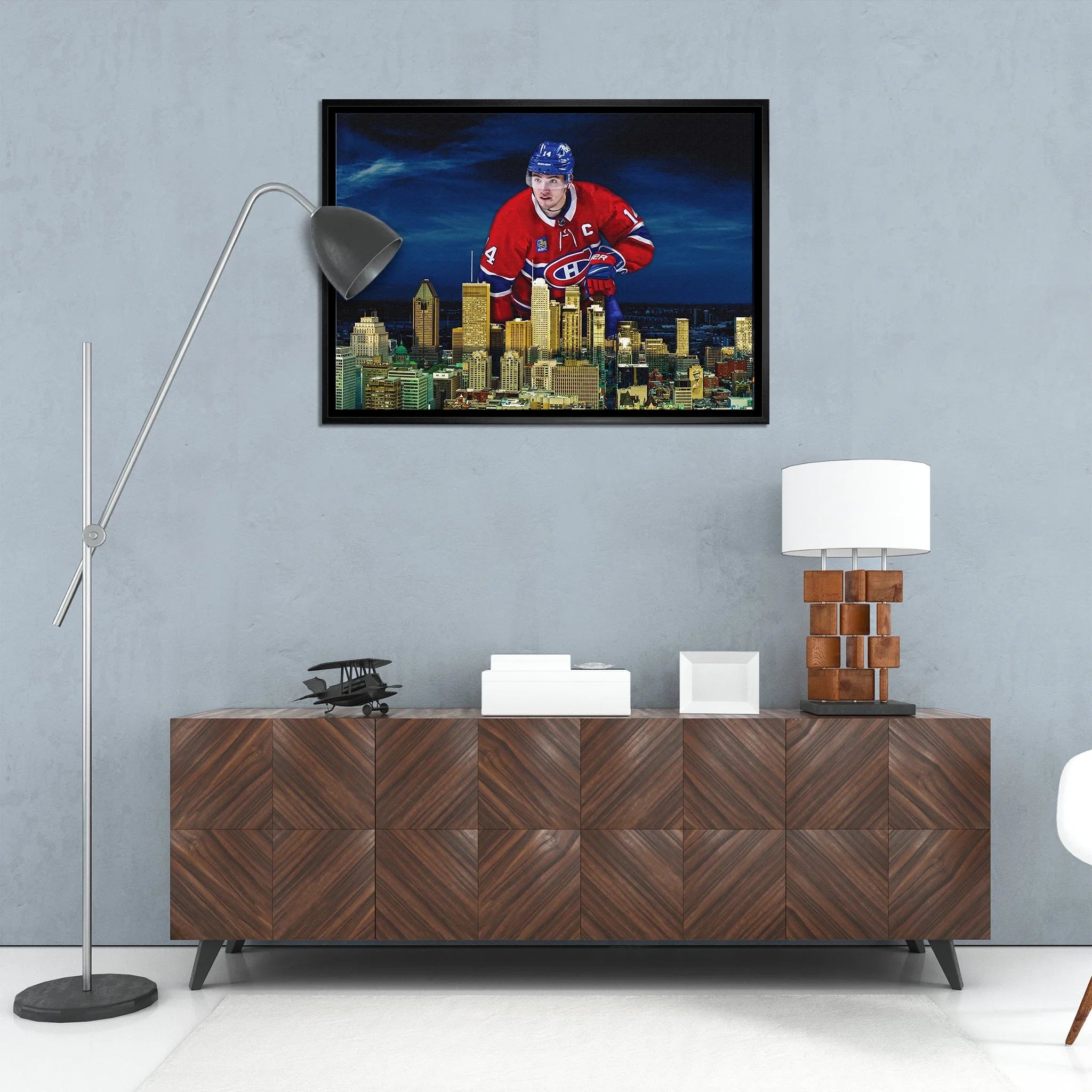 Modern living room with wood sideboard, art of hockey player over Montreal skyline on gray wall