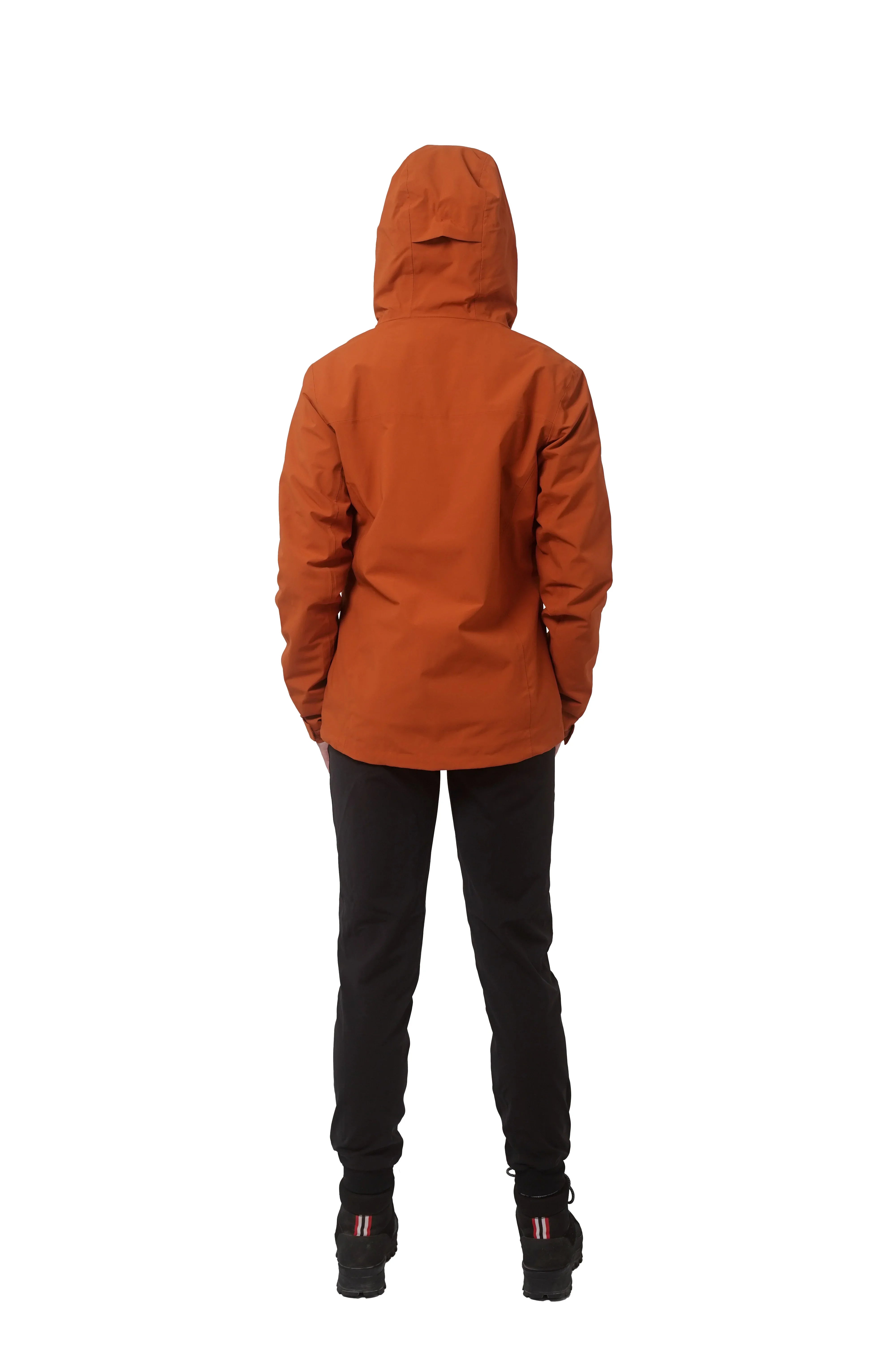 Woman wearing orange 3-in-1 jacket and black pants, shown from the back on white background