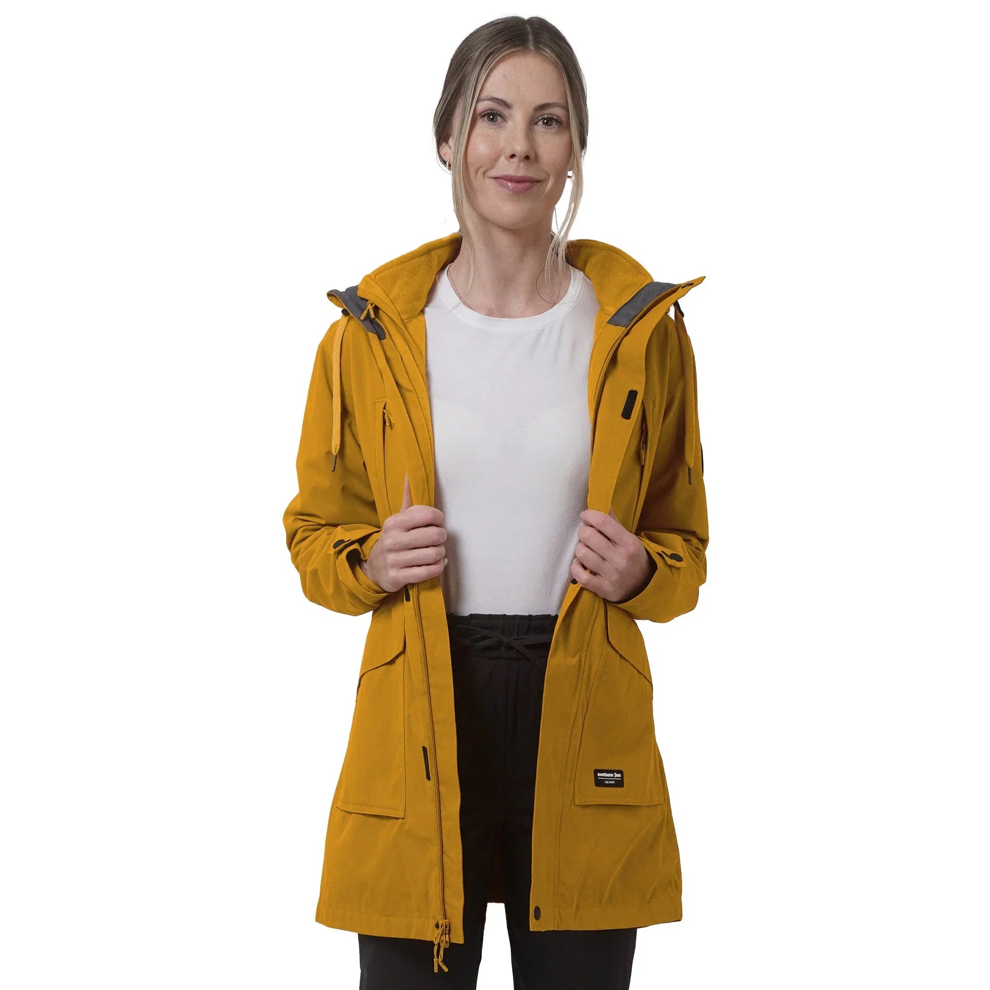 Woman wearing yellow mid-length 3-in-1 jacket, front open, white background