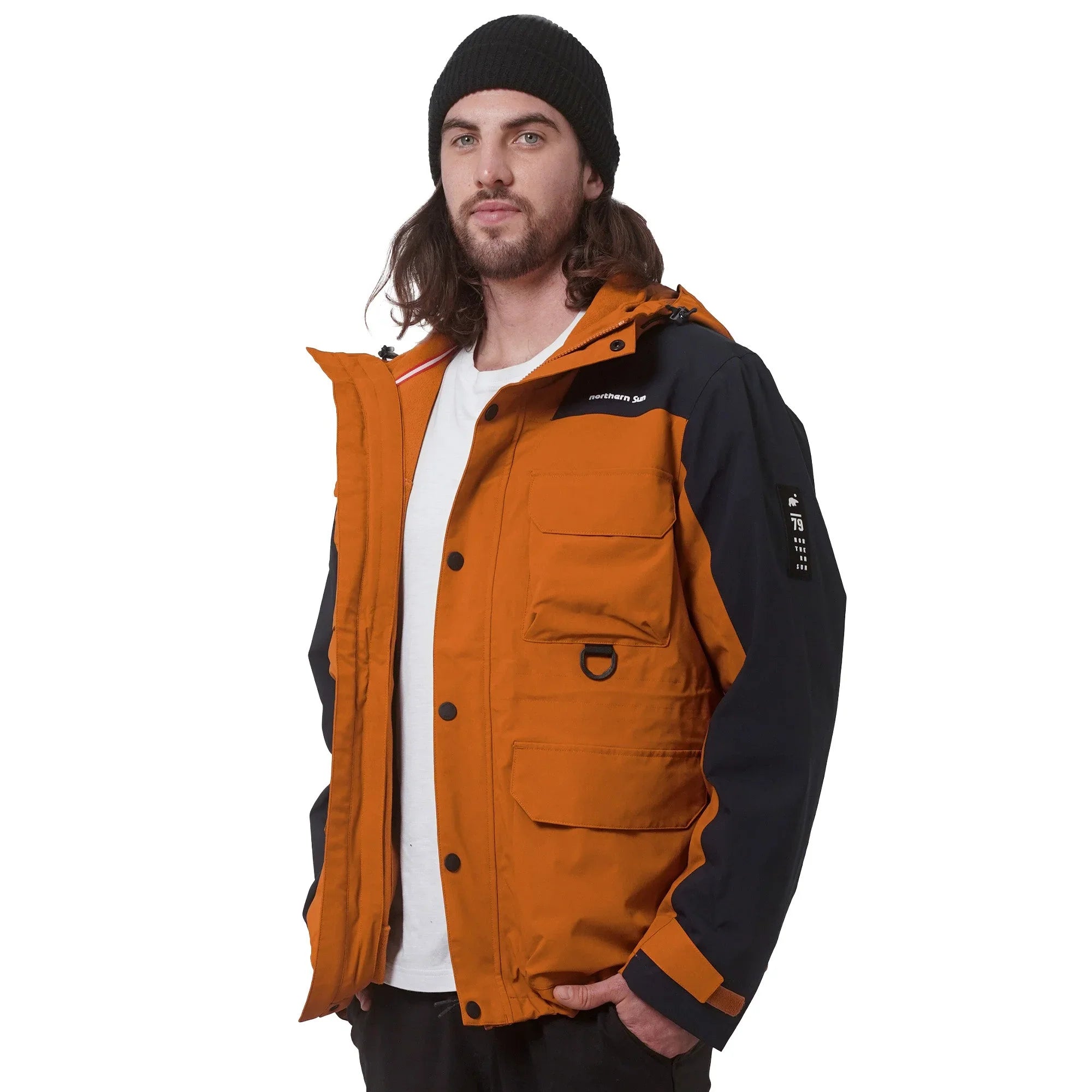 Man in orange and black 3-in-1 parka jacket with beanie, side view