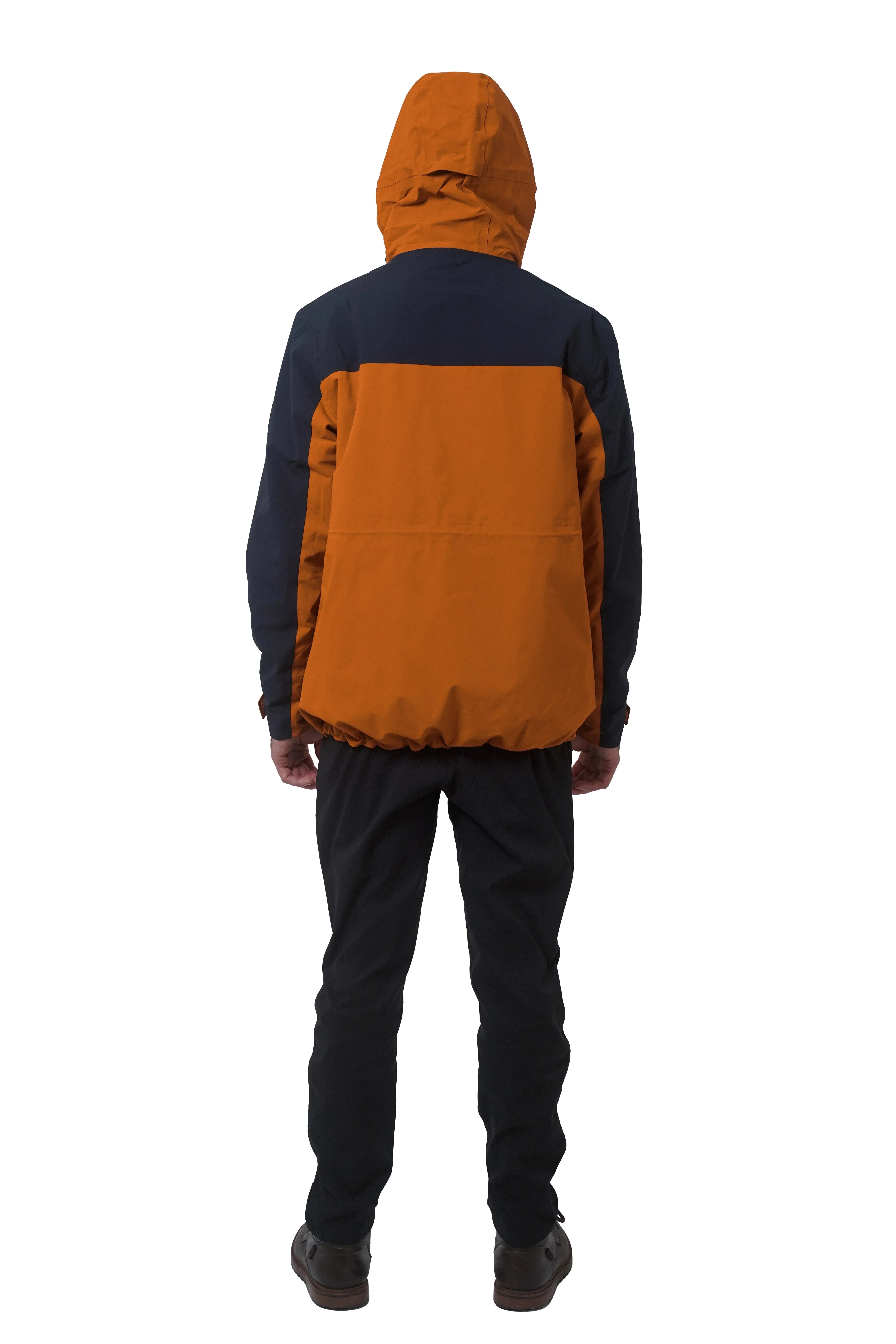 Back view of man wearing orange and navy 3-in-1 parka with hood up
